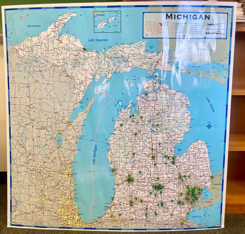 A map of Michigan with green push pins in every town where Dr. Ballard has presented.